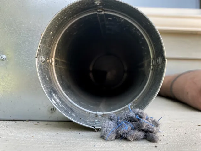 Perris Dryer Vent Cleaning technician using specialized equipment to clear severe dryer vent blockage in Perris